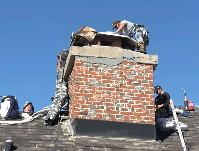 Coconut Creek Chimney Sweep installing a custom chimney crown in Coconut Creek, FL