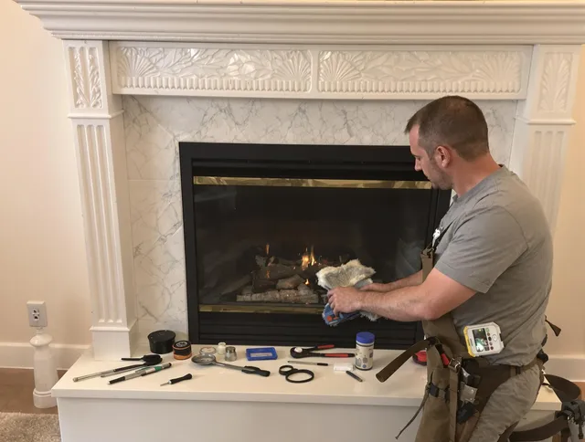 Coconut Creek Chimney Sweep performing fireplace maintenance in Coconut Creek, FL