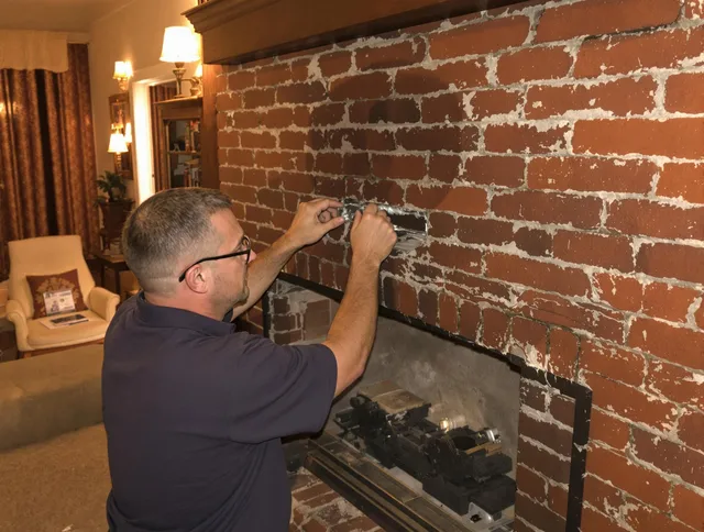 Coconut Creek Chimney Sweep expert fixing a fireplace in Coconut Creek, FL